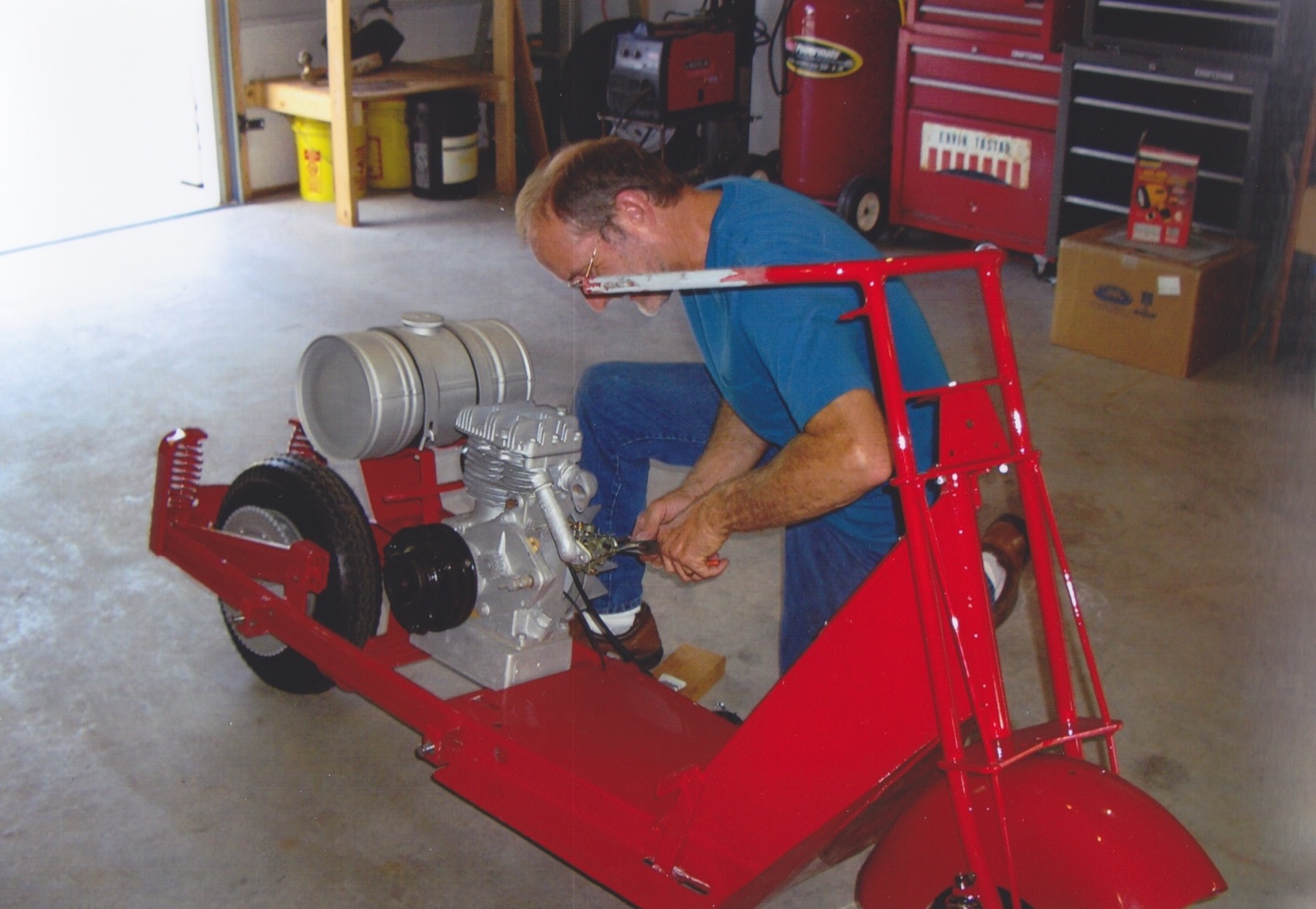 2012-11 2 Butchie Fixing Brad's scooter.jpg